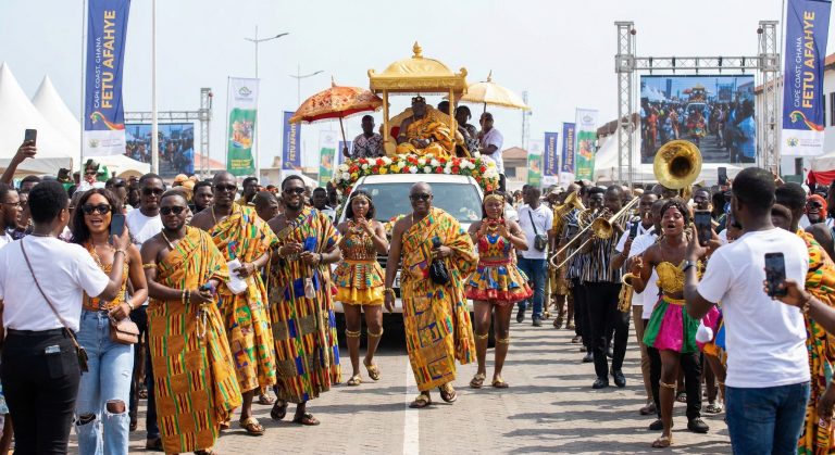 Chiefs and crowds in a festival procession