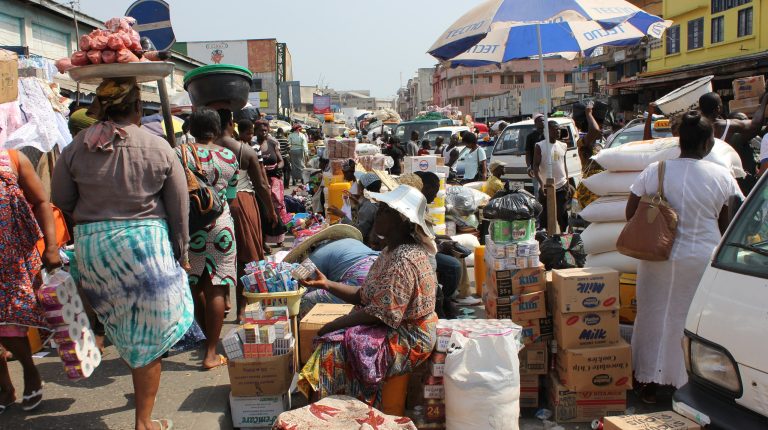 A busy street outside Makola Market in Accra