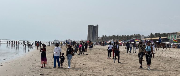 People walking along Labadi Beach in Accra